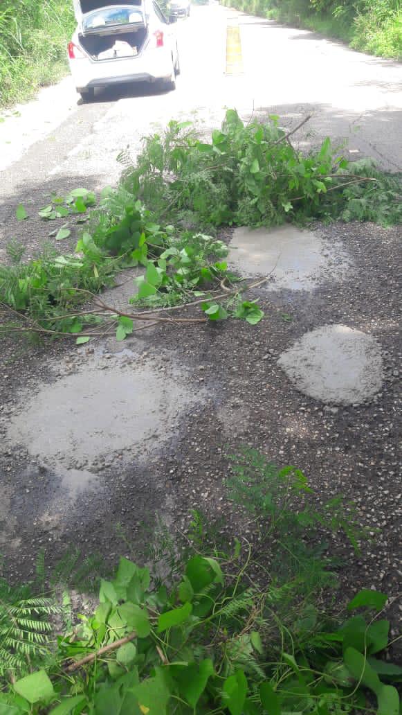 Reparan calle por sus propios medios