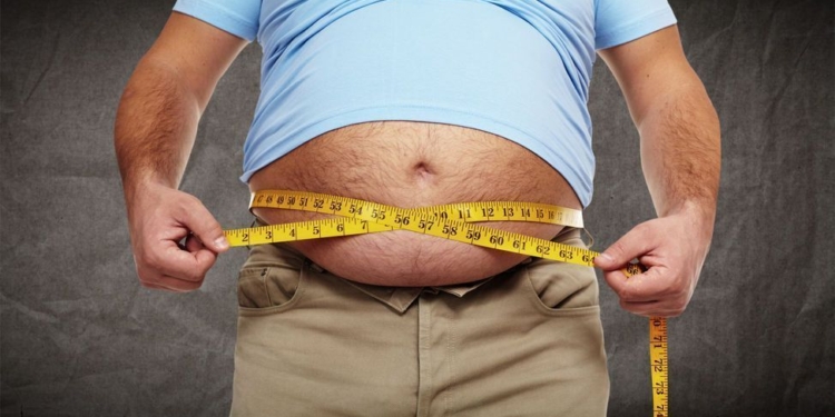 Fat belly. Man with overweight abdomen. Weight loss concept.